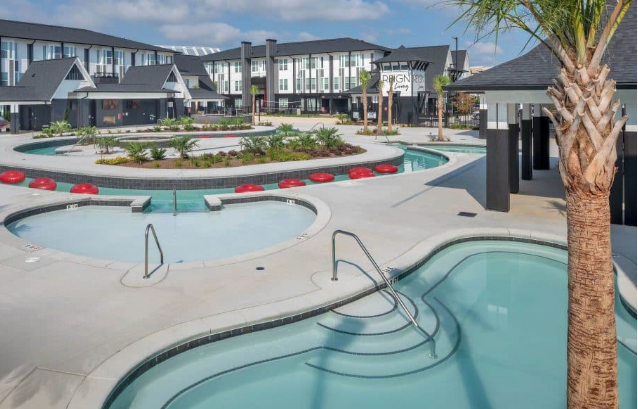 Aerial view of the commercial lazy river loop with hydrotherapy spa and lounge zones.