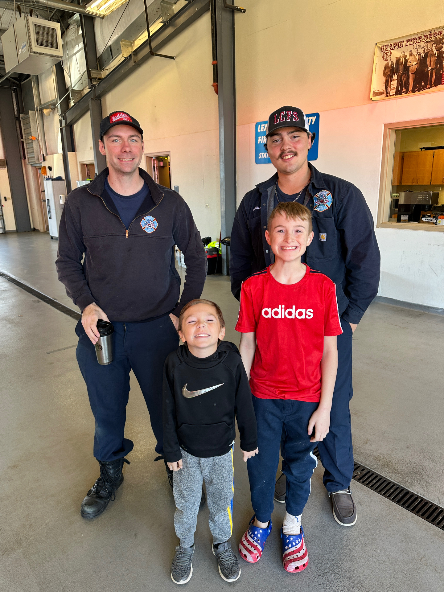 Children visiting the local fire station during Thanksgiving meal deliveries