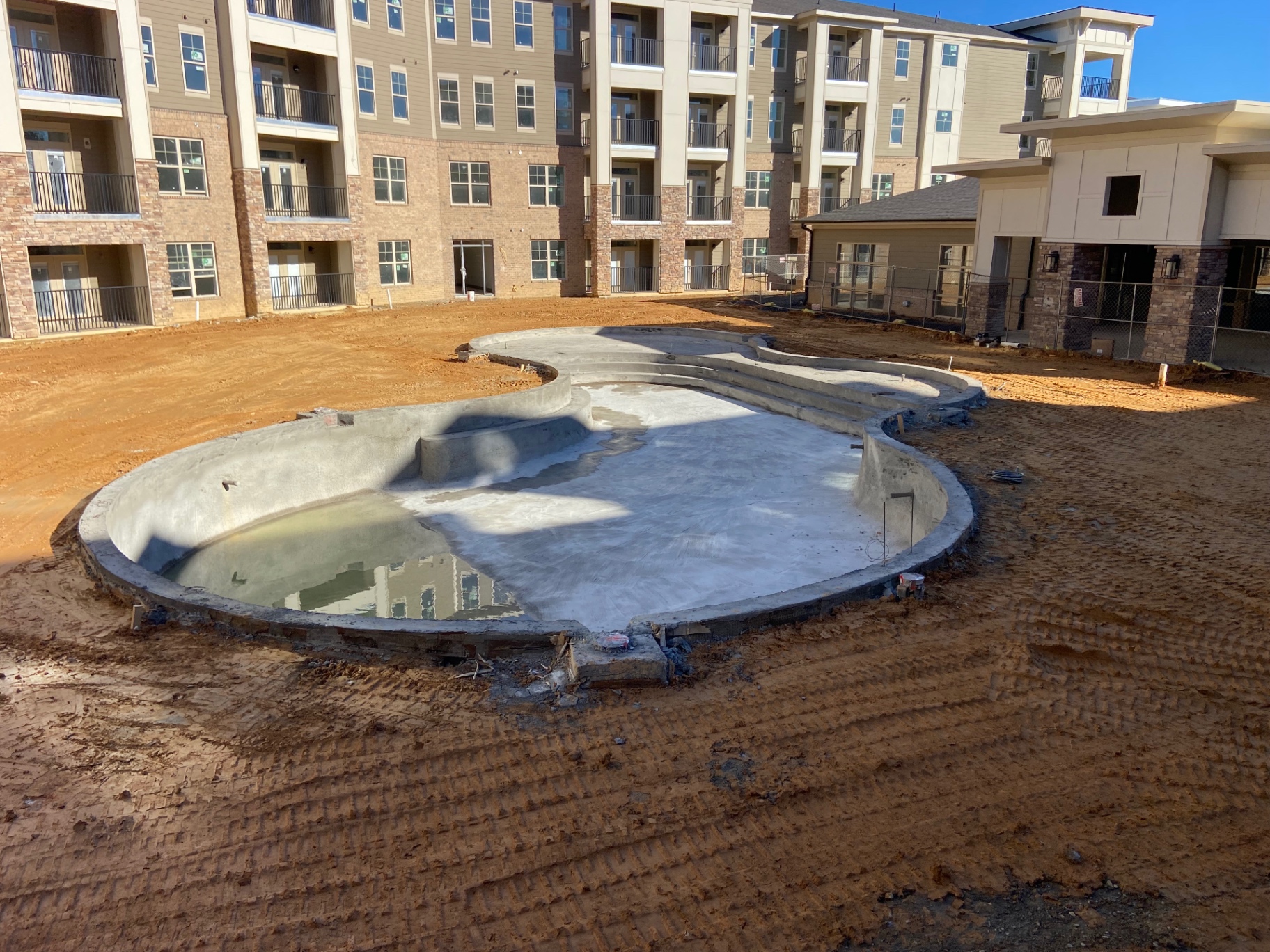 Pool shell construction in progress — early-stage build prior to coping, deck, and finish work.